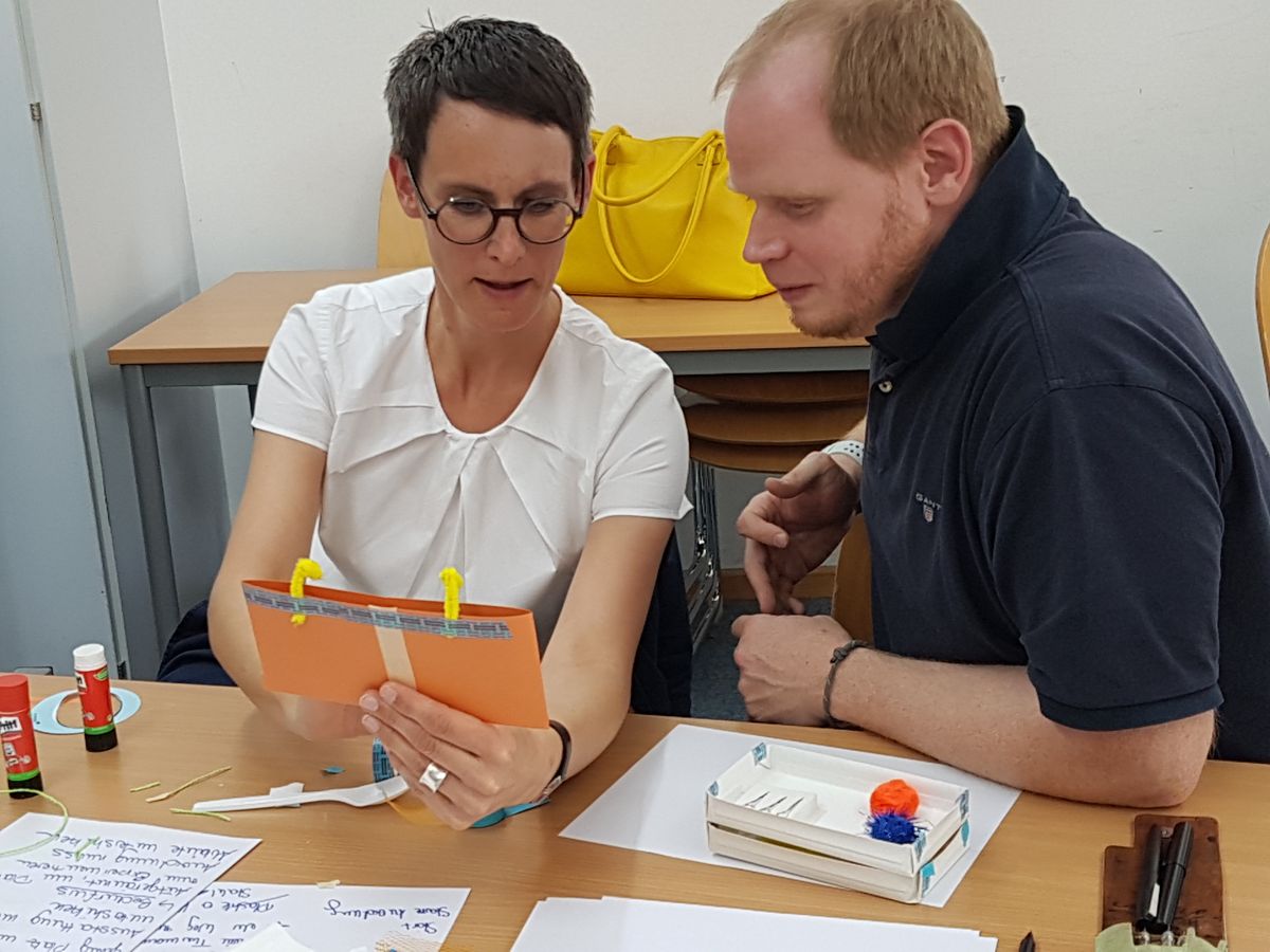 2 people sharing a prototype